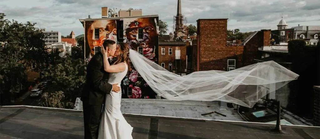 A couple with a flowing veil at Senate Garage in Kingston NY.